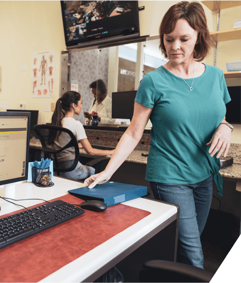 Woman walking to reception desk