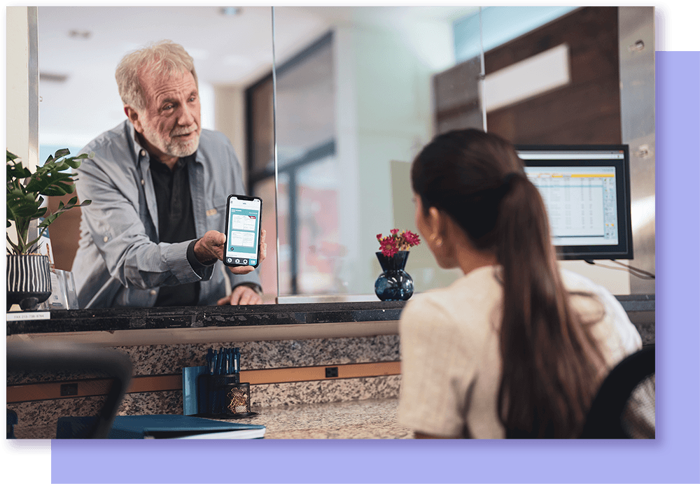 Man showing phone at clinic