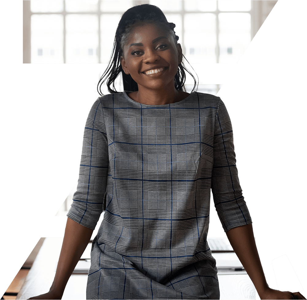 Woman leaning on desk smiling