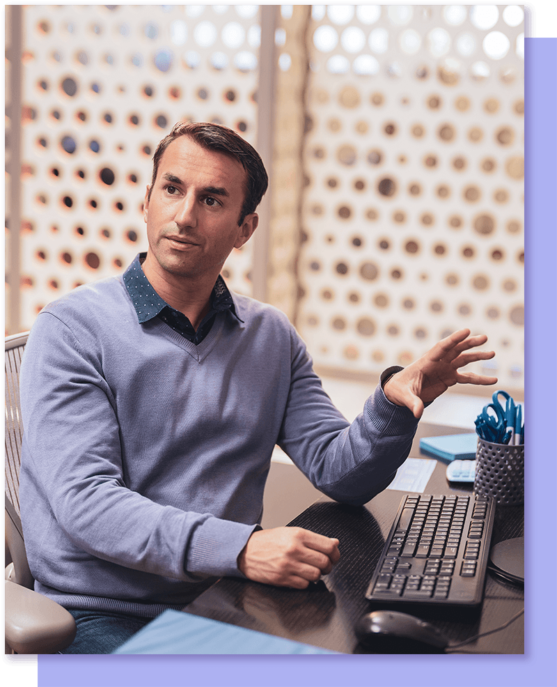 Man explaining something on computer screen