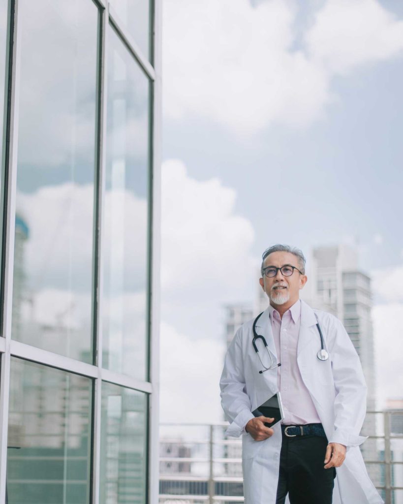 Provider walking in front of building