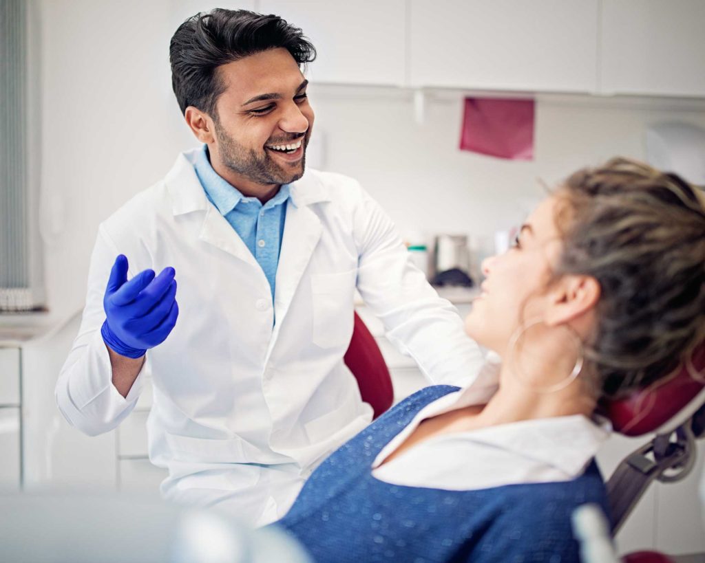 Dentist smiling at patient