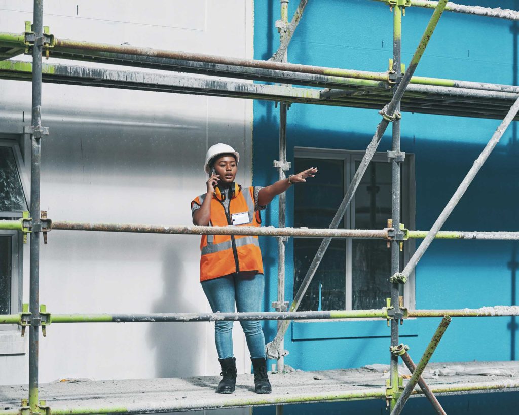 Construction worker managing site