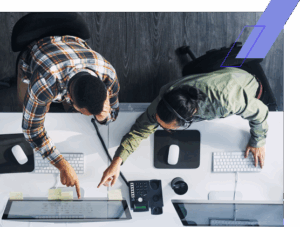 Two Men Pointing at Computer