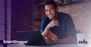 man looking at screen and smiling: Proven saving with SmartShopper : wakely report